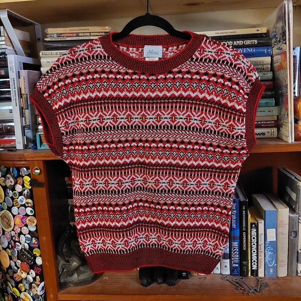 Vintage red, black, white, and tan geometric patterned sweater vest.‎